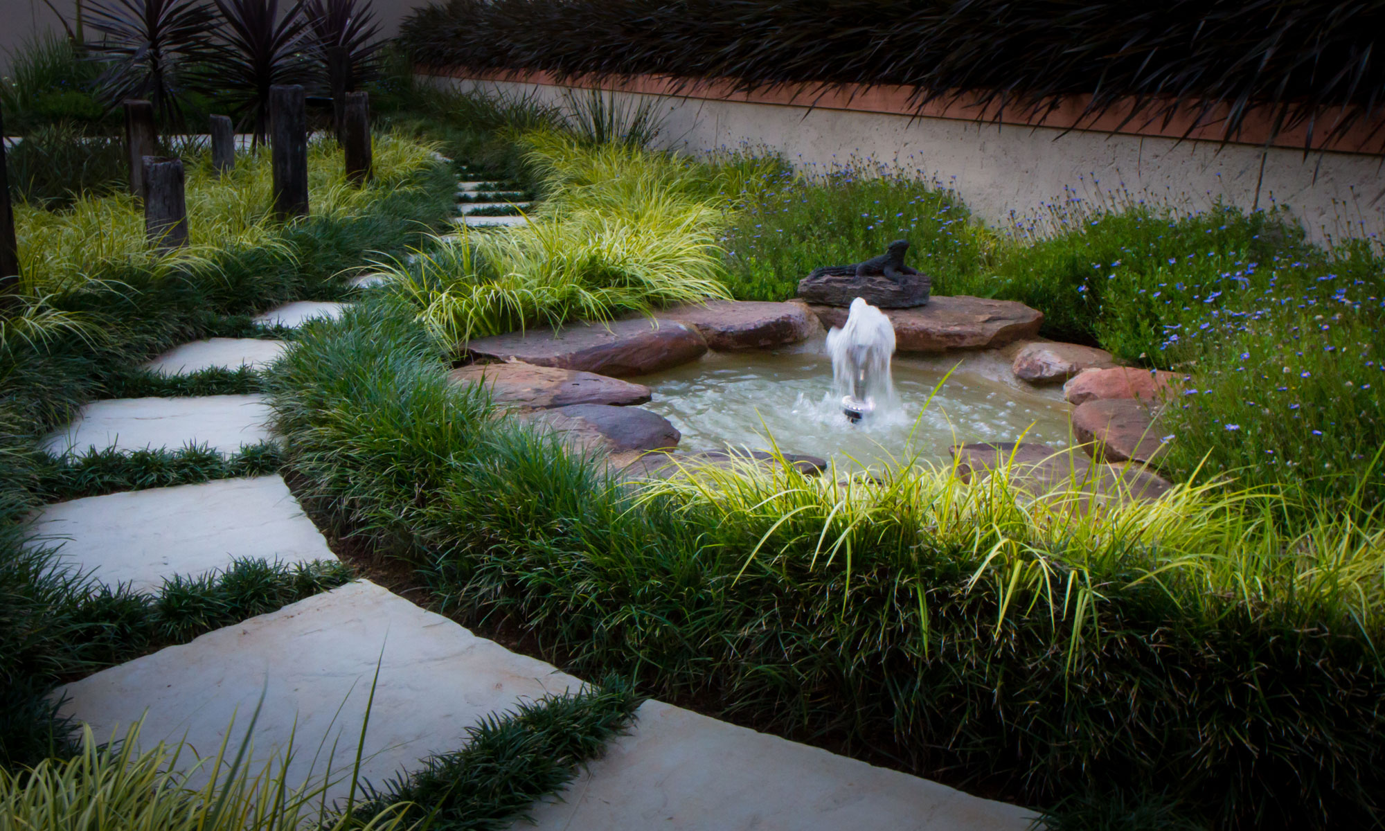 Small landscaped garden with water feature